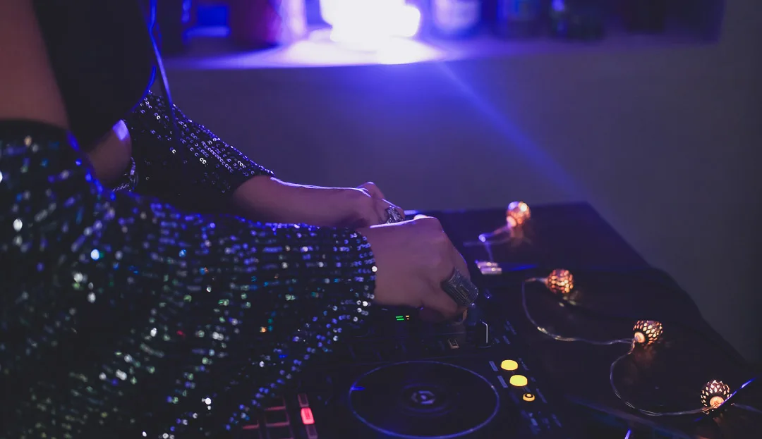 A DJ working the decks during an evening at Amigo Bar & Bistro